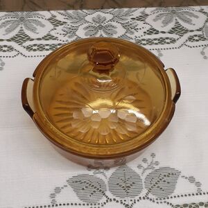 vintage jeanette candy dish amber glass with etched grape vine on lid.